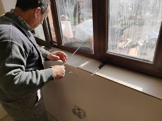 Bekir tiling the windowsills