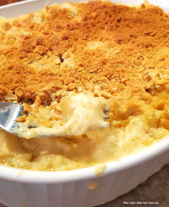 baked hash browns in a casserole dish with cheese, sour cream