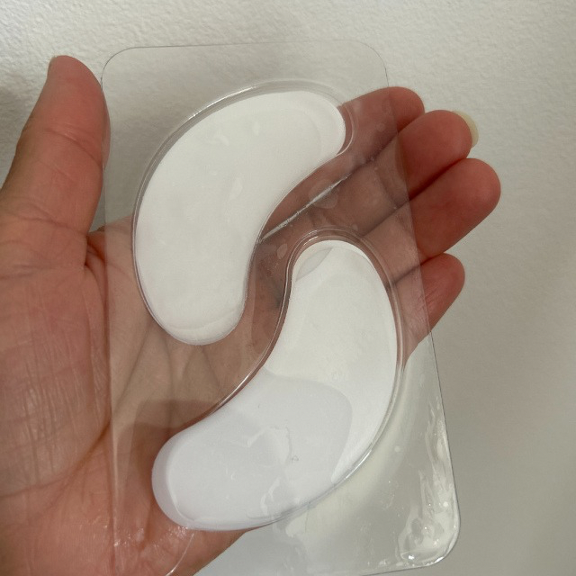 Close-up of Champneys Cooling Gel Eye Mask packaging featuring gel patches