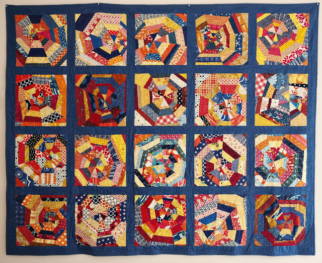 blue navy orange yellow spiderweb block quilt