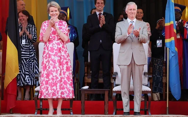 Queen Mathilde wore a cape red flower silk midi dress  moody florals by  Dries Van Noten