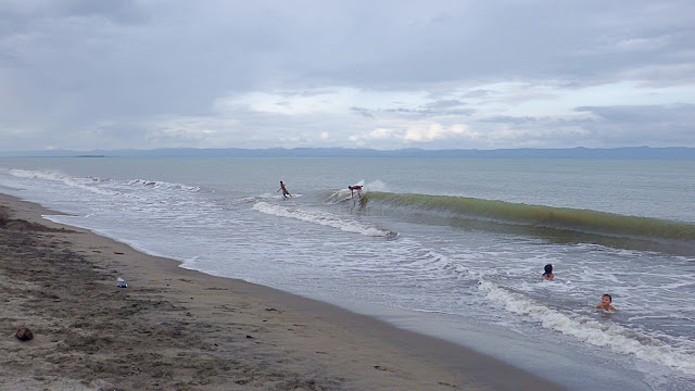 skimboarders riding it out on Red Beach Baras, Palo Leyte