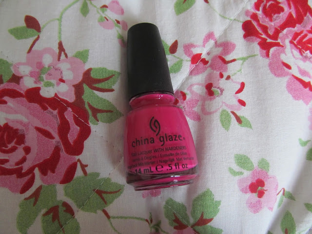 round triangular hot pink nail polish bottle