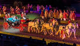 The queen in a horse drawn carriage kynren