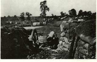 Yankee gun flanking Peachtree St. outside of Atlanta is emplaced similarly to cannon called “Petersburg” by Sharpshooters. Rifleman Bronson caused gun to burst by kicking sand from revetment into muzzle from rifle bullet hits.