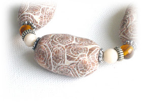 Beige seashell print bracelet created from polymer clay