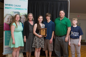 Tara Lambert receives Youth of the Year Award alongside her family