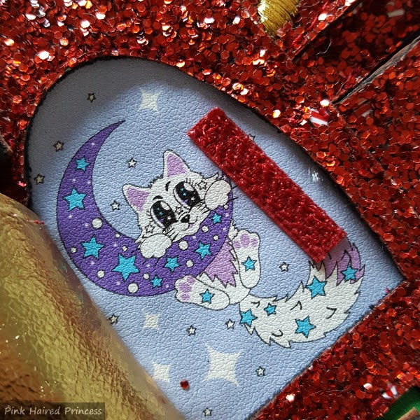 open advent door showing space kitty on moon picture