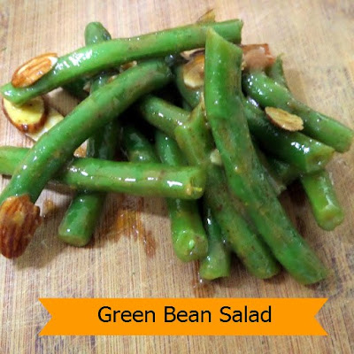 Green Bean Salad:  Crispy green beans in a honey mustard vinaigrette with sliced almonds.  A simple and quick vegetable side for any meal.