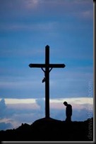Praying at cross