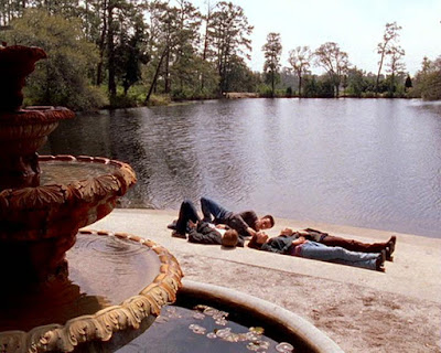 Dawson, Joey, Jack, and Jen laying on the ground by a fountain