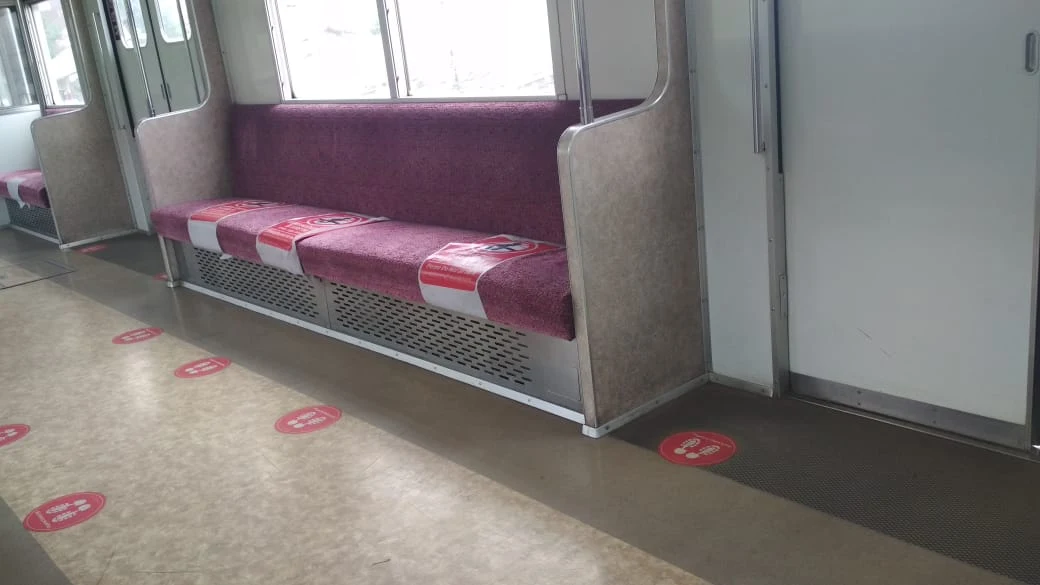 Stiker tanda social distancing di dalam kereta KRL Commuter Line