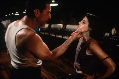 A sweaty, brutish Warwick (Stephen Macht) forcefully grabs Jane's (Kelly Wolf) chin in a movie scene for the horror film Stephen King's Graveyard Shift