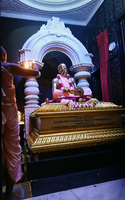 Pujari Offers Ghee Lamp to Srila Prabhupada at Mangala Arati at Srila Prabhupada's Samadhi in Vrindavan, India