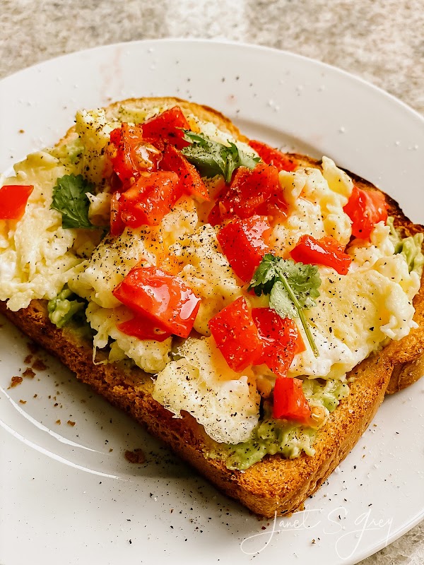 Avocado Toast with Scrambled Eggs and Fresh Garden Tomato