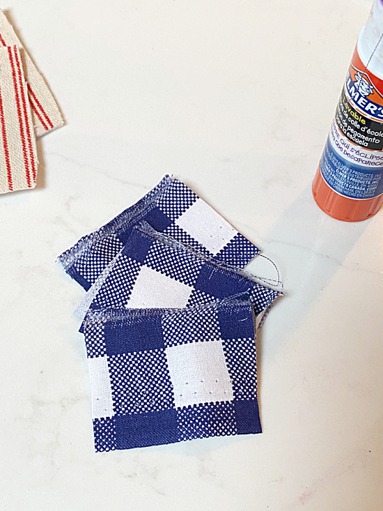 blue checked fabric and glue stick