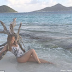 The UFC fighter Ronda Rousey poses naked in body paint for Sports Illustrated