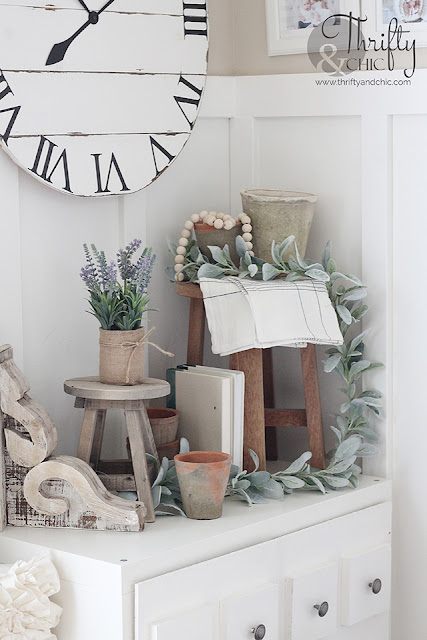 Farmhouse spring living room decor and decorating ideas. Living room inspo. Living room inspiration. White and wood living room. Spring mantel decor. spring mantle decorating ideas. Boho style living room. 