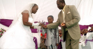 kissing; 8-year old; bride; masilela; shabangu; traditional; wedding; walk; street; kissing; 8-year old; bride; masilela; shabangu; south africa