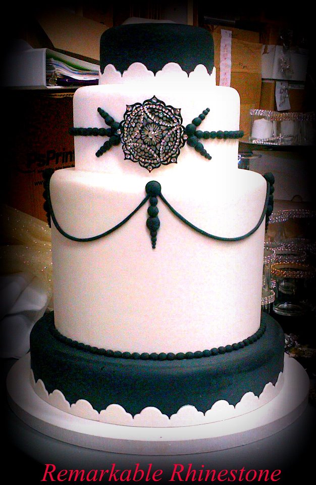 Our black and white gleaming rhinestone pin easily dazzles the cake up and