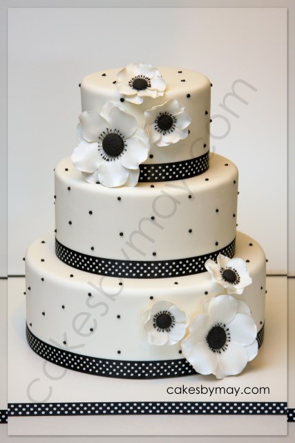 This elegant white and black cake design was adorned by the beautiful 