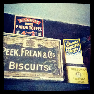 Old biscuit tins in the kitchen at Avebury Manor