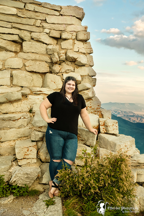 Professional senior photograph of a beautiful girl in the mountains