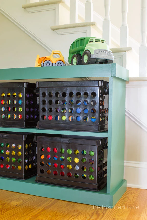 The easy way to build furniture! Learn how simple it is to use the Kreg Jig to build a DIY wooden toy storage shelf.