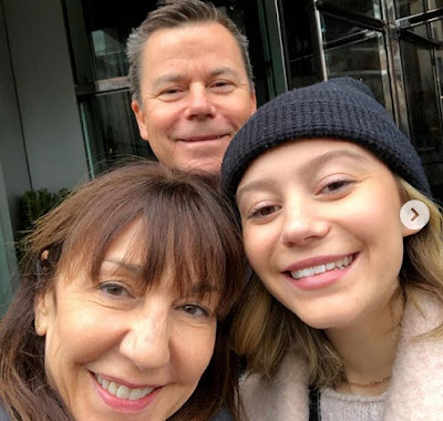 G Hannelius with her parents