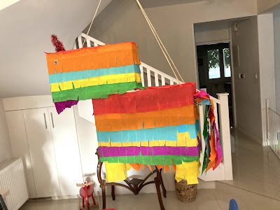 donkey pinata hanging from chandelier