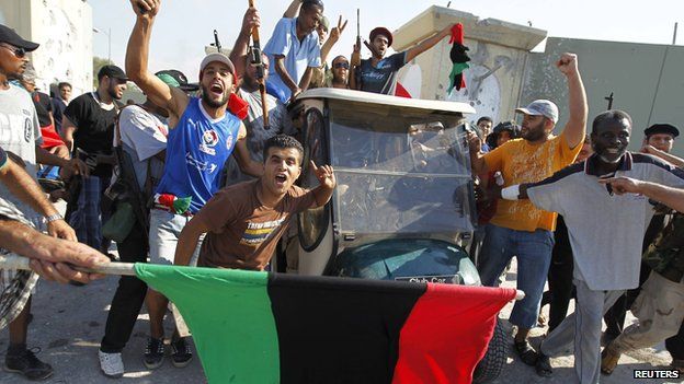 Today in History: Libyan rebels celebrate at Gaddafi’s compound in Tripoli
