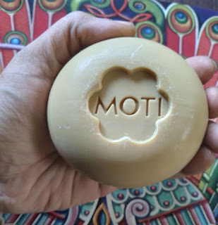 Moti sandal or chandan soap in hand