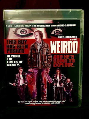 The blu-ray cover of THE WEIRDO shows Donnie holding a severed head and screaming, while the bullies lurk in the background and two eyes watch in horror, with text that reads, A lost classic from the legendary grindhouse auteur.  Andy Milligan’s The Weirdo.  this boy has been pushed beyond the limits of sanity…and he’s going to explode!  Boy meets girl.  Boy kills everyone.  A love story only Andy Milligan could make. - Frank Henénlotter, director of BASKET CASE & BRAIN DAMAGE