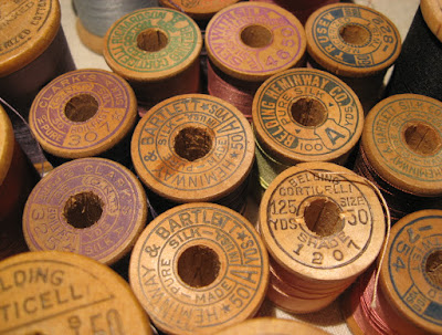 embossed wooden thread spools