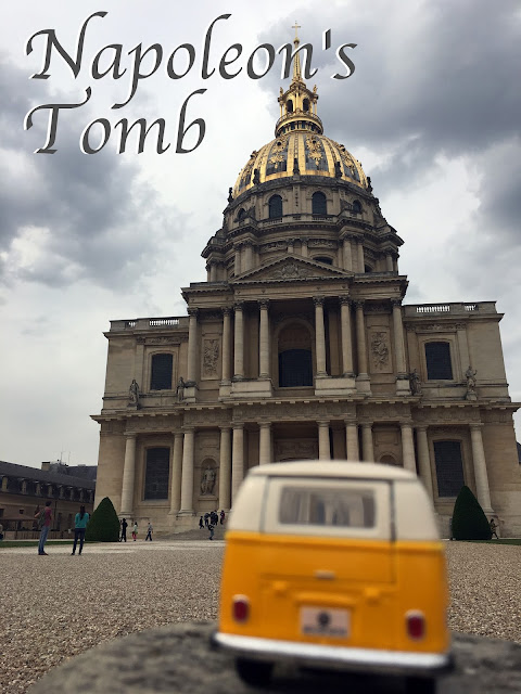 Title card with yellow van outside Napoleon's tomb