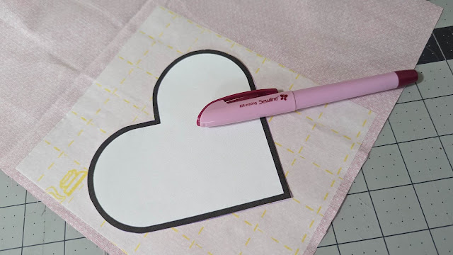 Tracing hearts to make a Valentine mini quilt