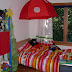 kid's bed with a little cupola