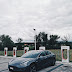 What were the factors and implications behind Elon Musk's decision to conduct mass firings of Tesla Supercharger staff, and how did it affect the company's operations and employee morale?