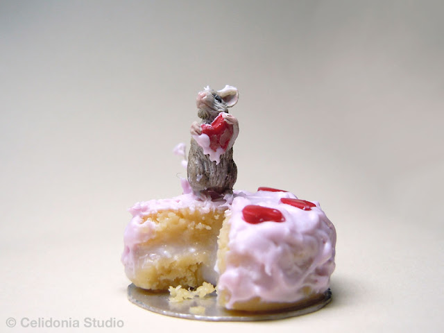 miniature mouse on cake