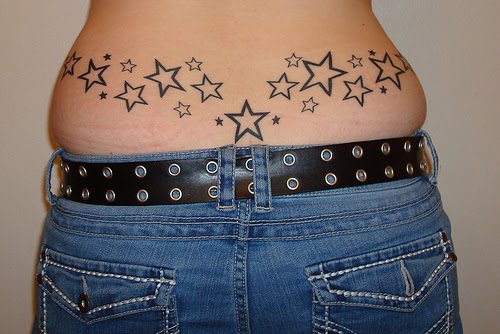 star tattoos on back men. lower ack tattoos stars.