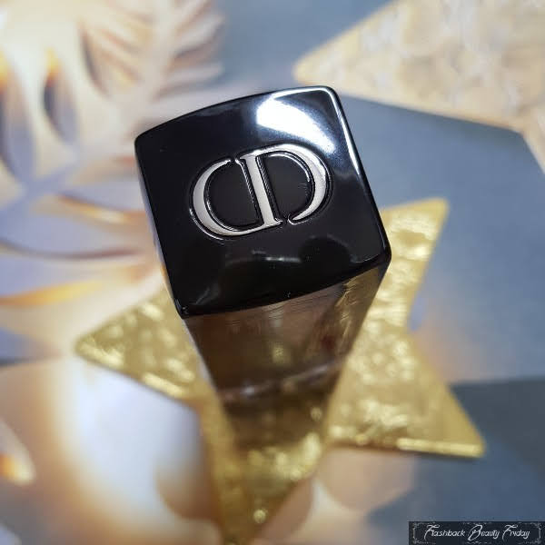 close up of silver CD logo on top of Dior lipstick