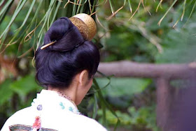 gold hairpeice on white robed woman