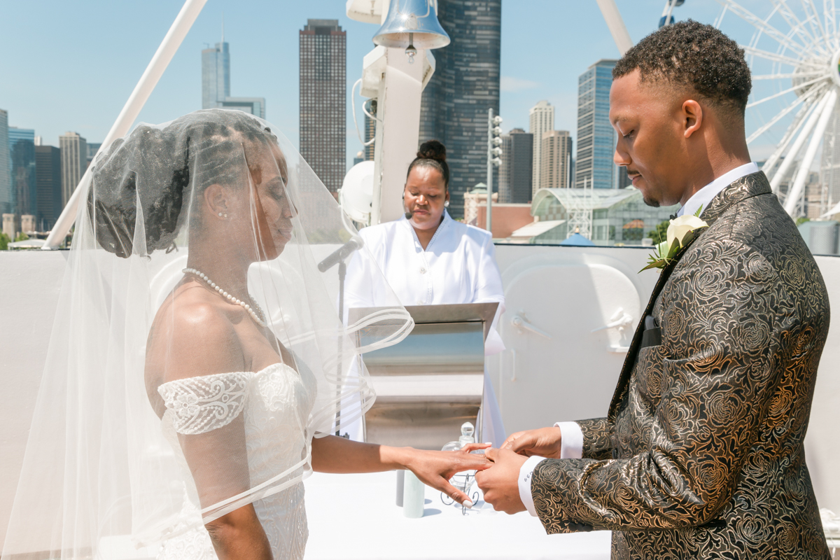 Couple Exchanging Vows And Wedding Rings.