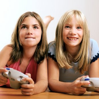 two girls play video games in a NAMC montessori home