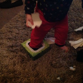 picture of toddler with foot in tissue box