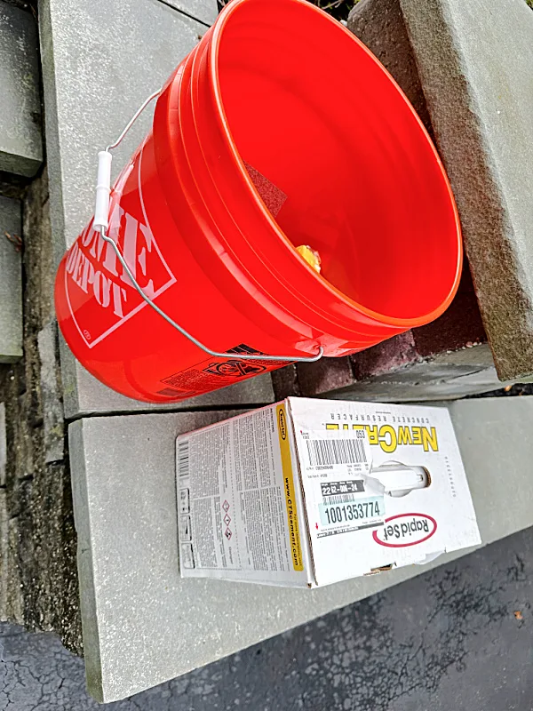 bucket and box of cement