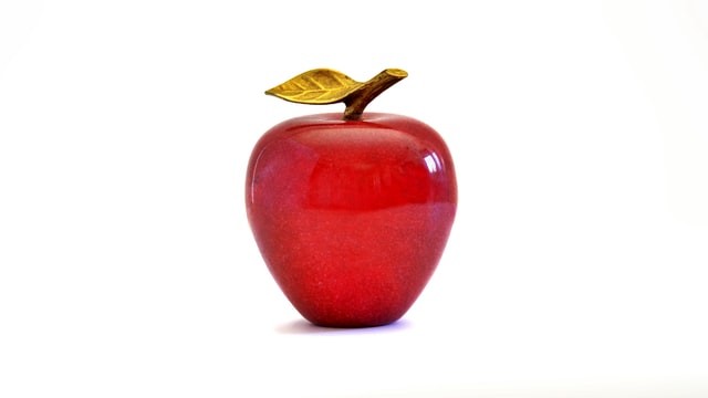 Shiny red apple on a white background