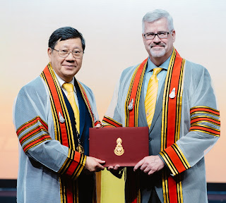 Dr. Mark Bowyer, the Ben Eiseman Professor of Surgery in the Department of Surgery at USU (right),  receives the honorary fellowship from RCTS President Dr. Pramuk Muthirangkun, MD (left) on July 27, 2023. (Photo courtesy of the Royal College of Surgeons of Thailand).