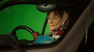 Picture of Robert Arnold's wife June Brown driving the car