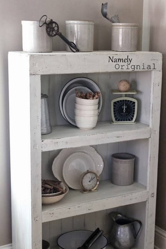 http://namelyoriginal.blogspot.com/2014/02/laminate-bookshelf-repurposed.html